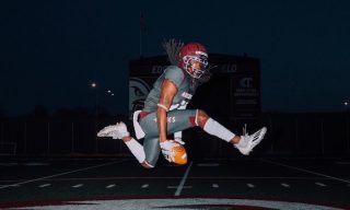 Football player jumping in the air